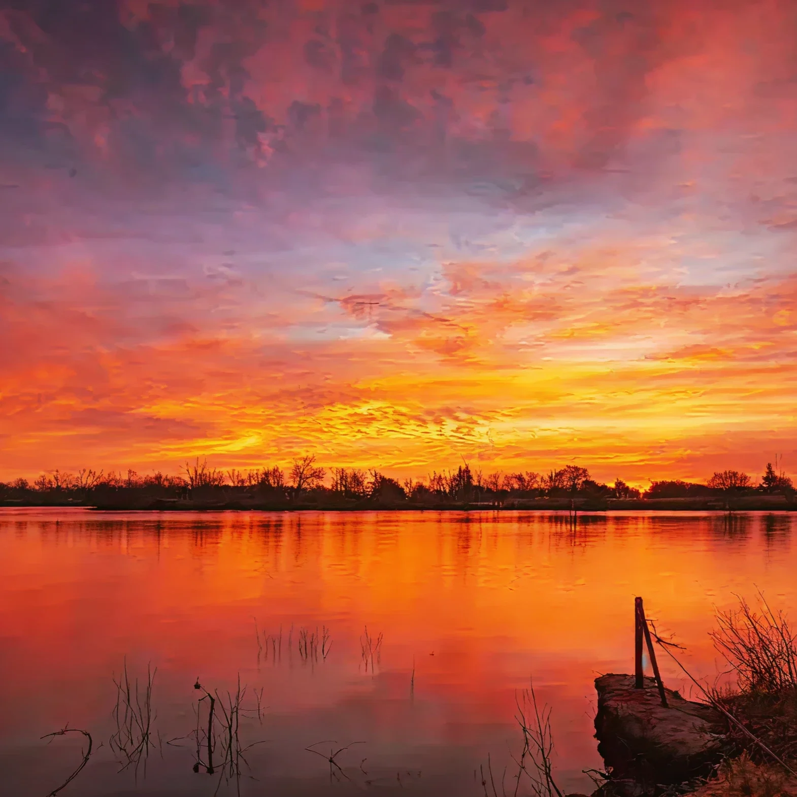 Fiery sky reflecting on water